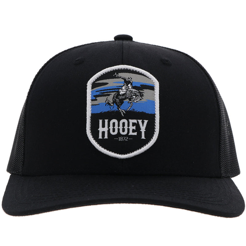 front of black on black Cheyenne hat with blue, grey, black Cheyenne artwork patch