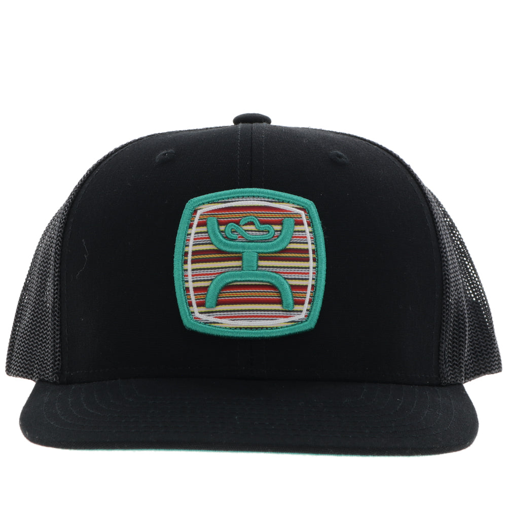 front of all black Hooey hat with serape and teal patch