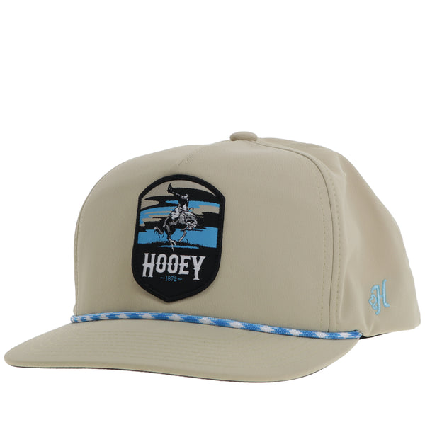 all tan Cheyenne hat with blue and white rope detail and blue with black logo patch