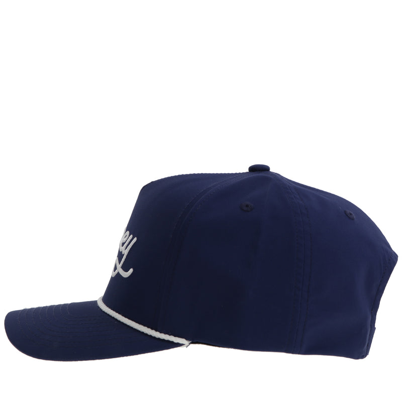 the right side of the navy blue hat with white rope detail and logo stitching