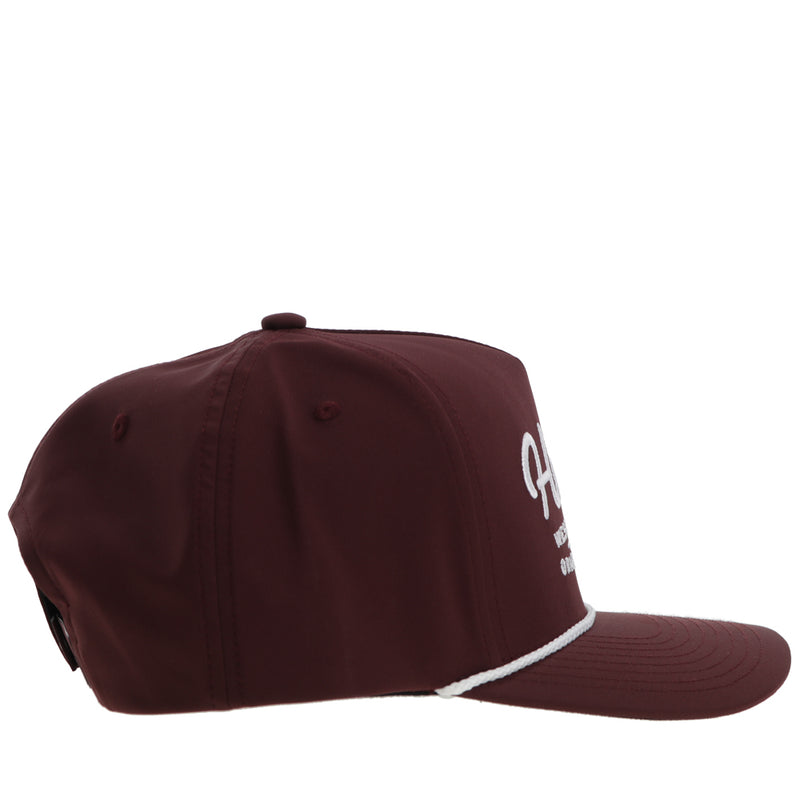 right side of maroon hat with white rope details