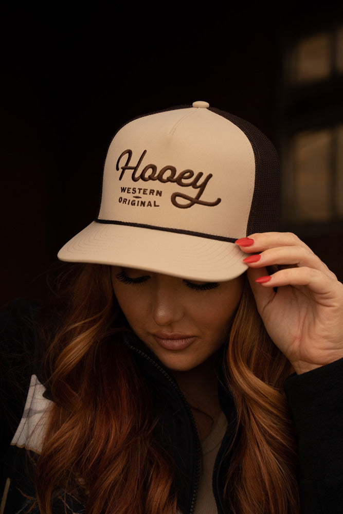 tan and brown Hooey hat worn by female model