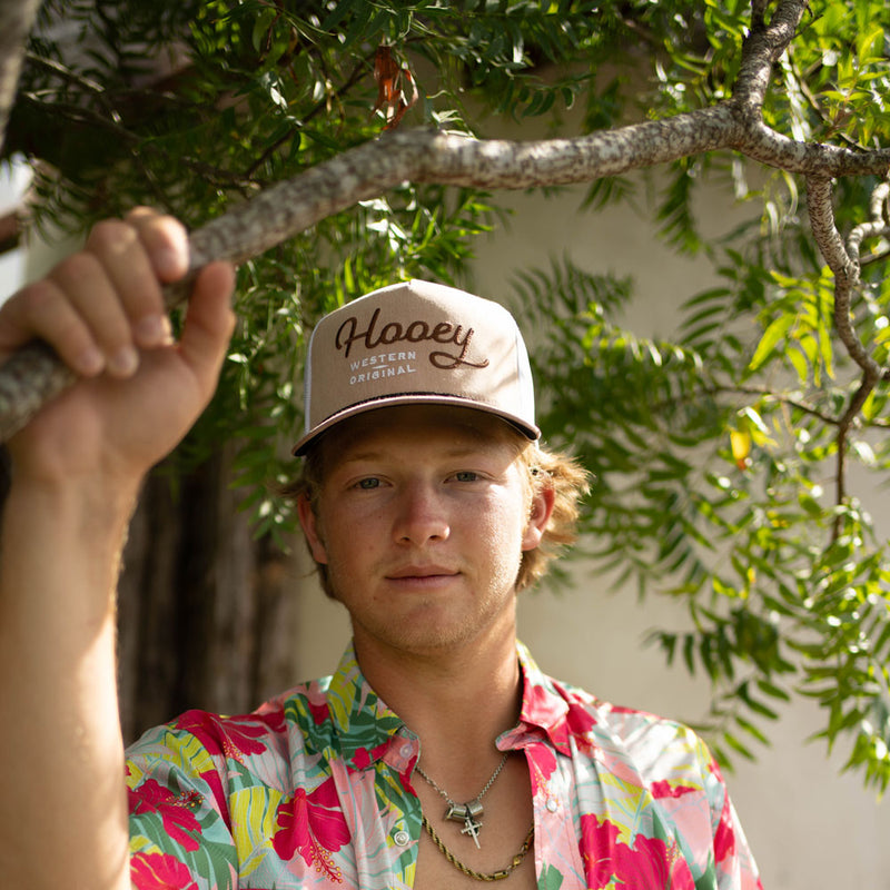 male model posing in tan hooey hat
