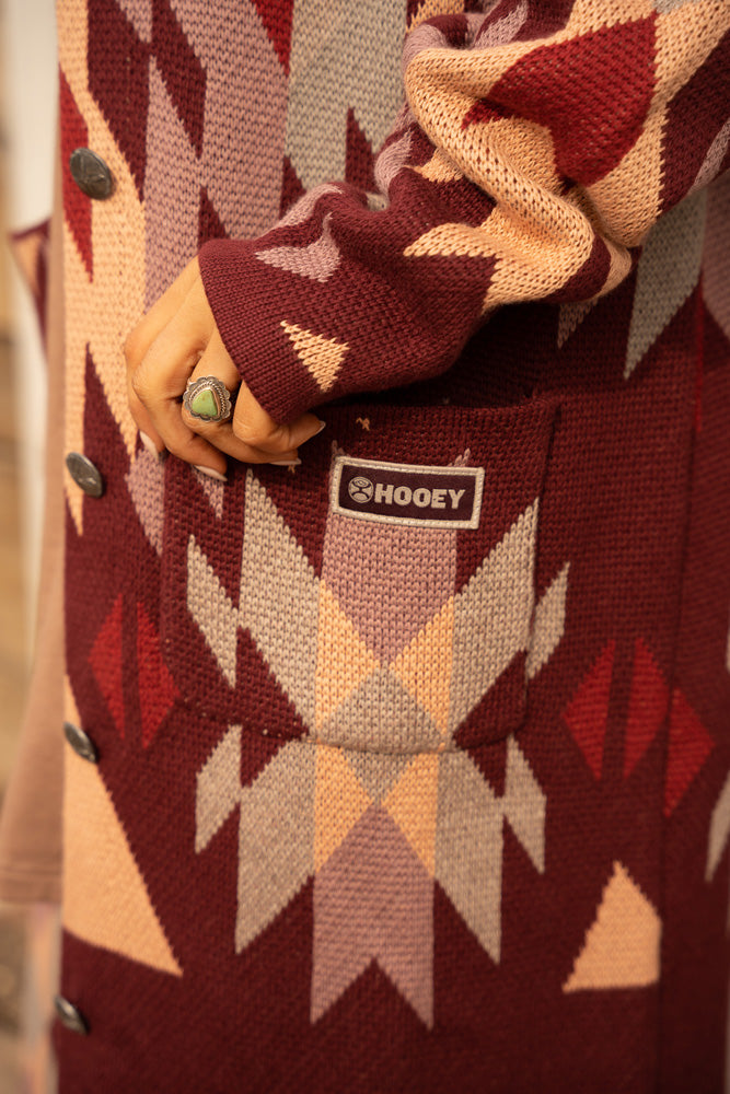 close up of burgundy Aztec print duster