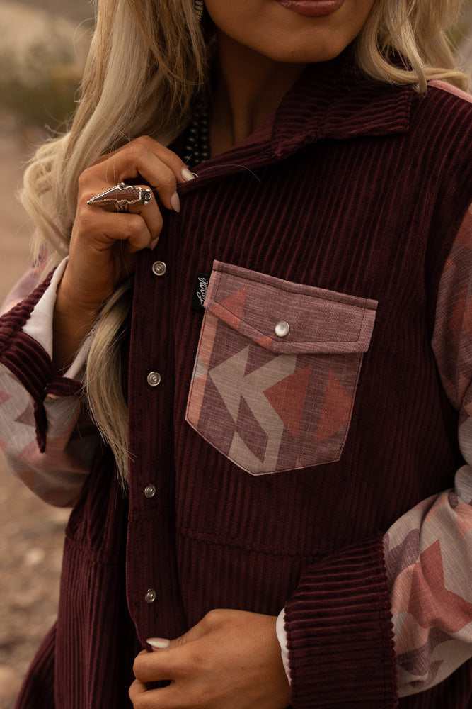 close up of burgundy corduroy jacket with aztec pocket 