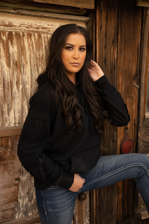 model wearing the Chaparral black hoody with crochet mesh