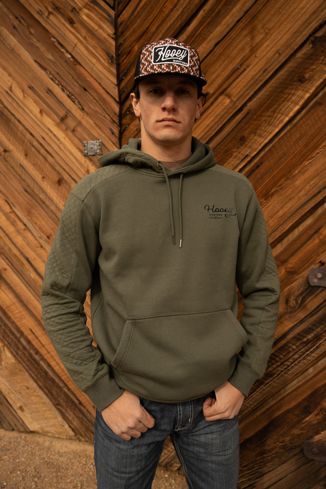 model wearing the canyon olive with black logo hoody