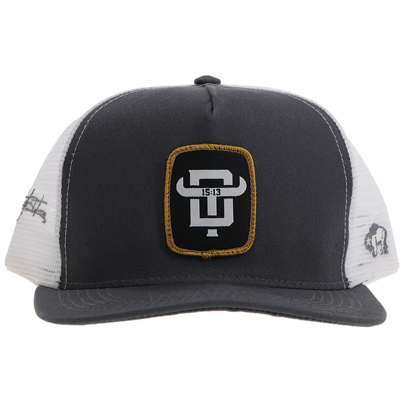 front of grey and white hat with gold, black, and white logo patch
