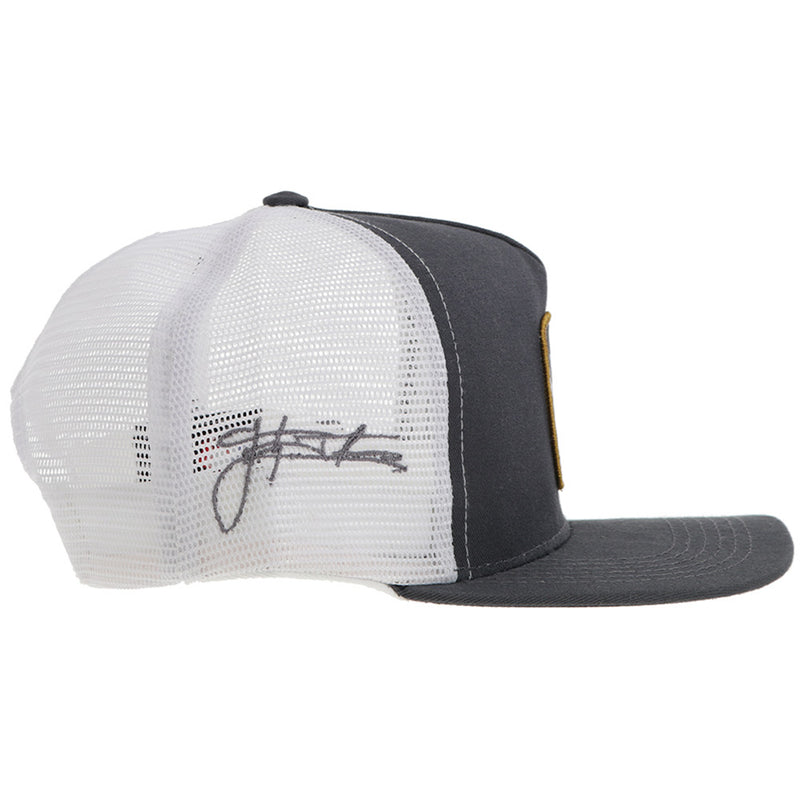 right side view of grey and white hat with grey script logo