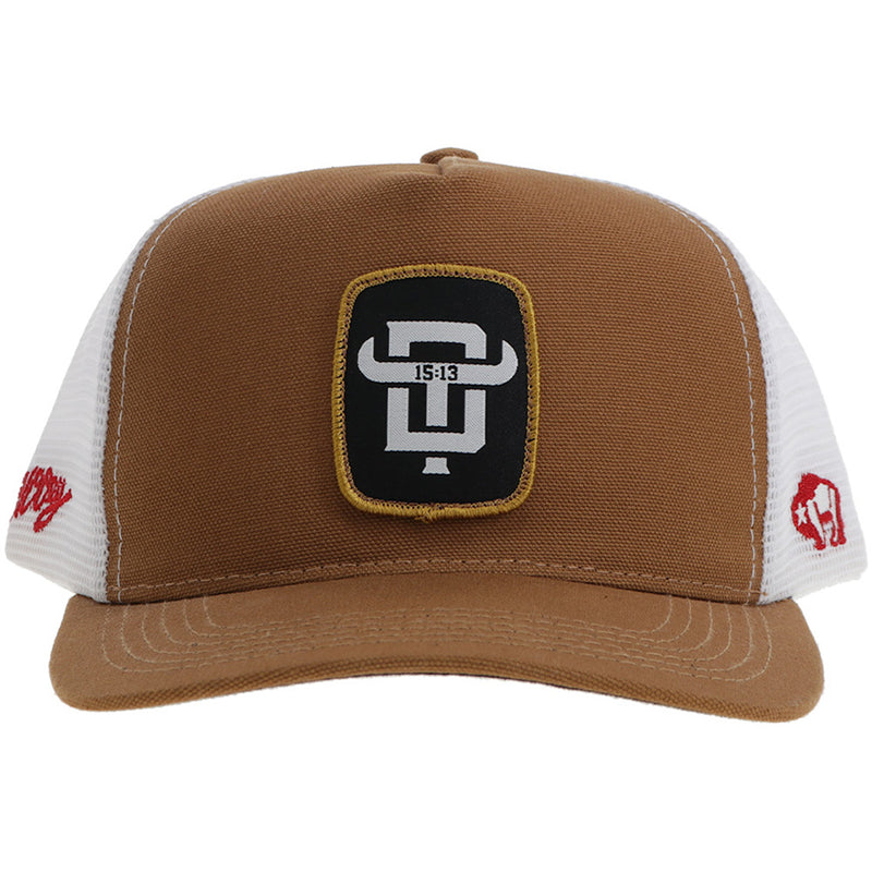 front of brown and white hat with black and white patch