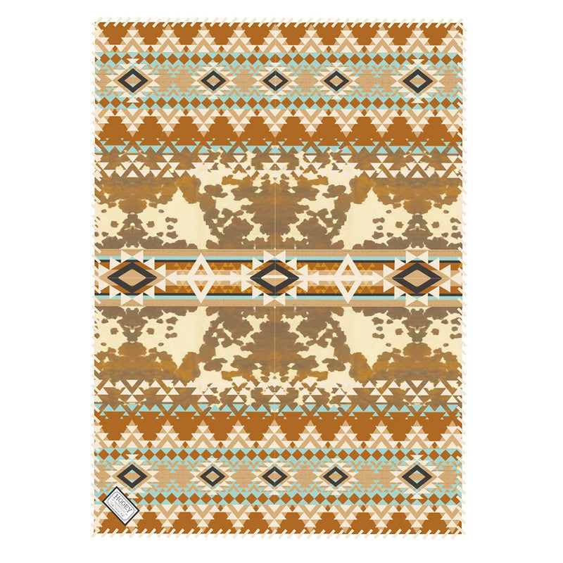 brown, turquoise, cream aztec and cow print rug