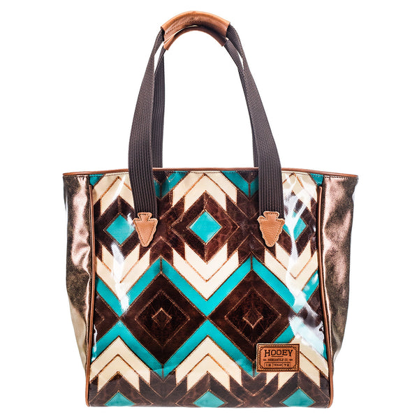 front of turquoise, brown, white, Aztec pattern tote bag