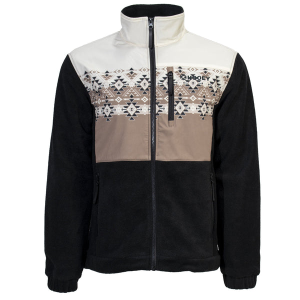 front of black jacket with tan, black, and white aztec and stripe pattern on chest