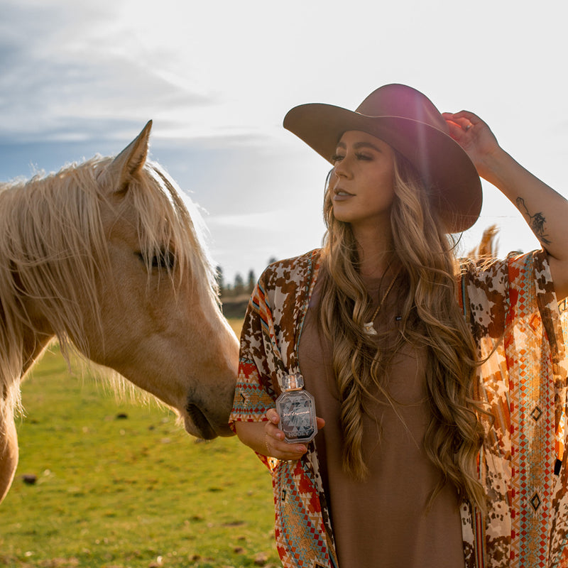 west desprado perfume model with horse in field 