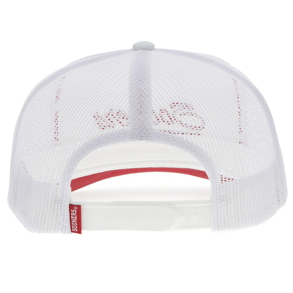 back of white Sooners hat with red and white sooners tag