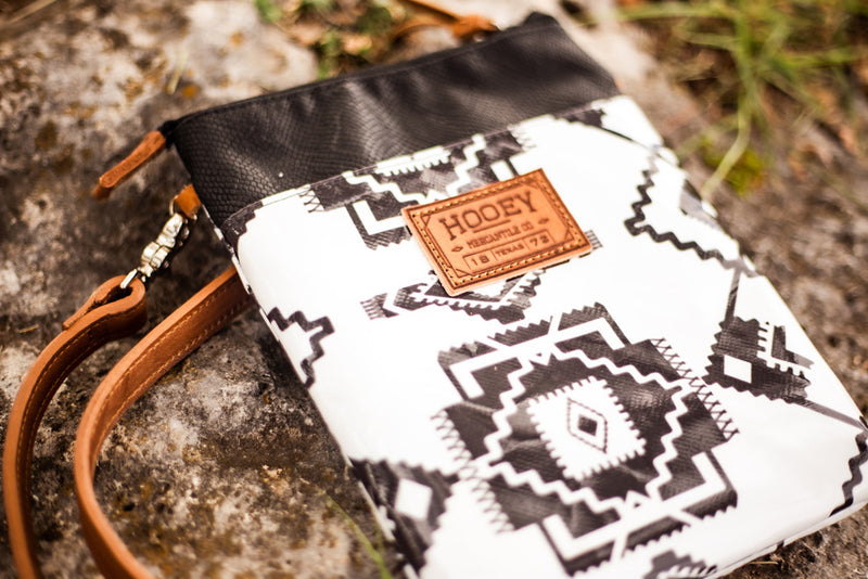 front of black and white Aztec pattern cross body