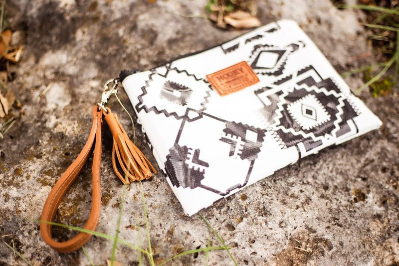 front of black and white Aztec pattern wristlet