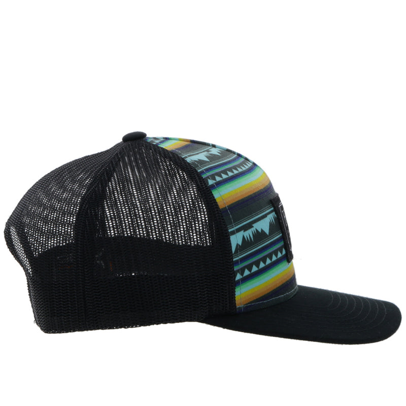right side of the Doc black hat with yellow, blue, teal, and black Aztec pattern on front