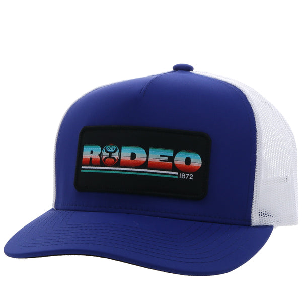 Youth Rodeo blue and white hat with black patch featuring RODEO logo in serape