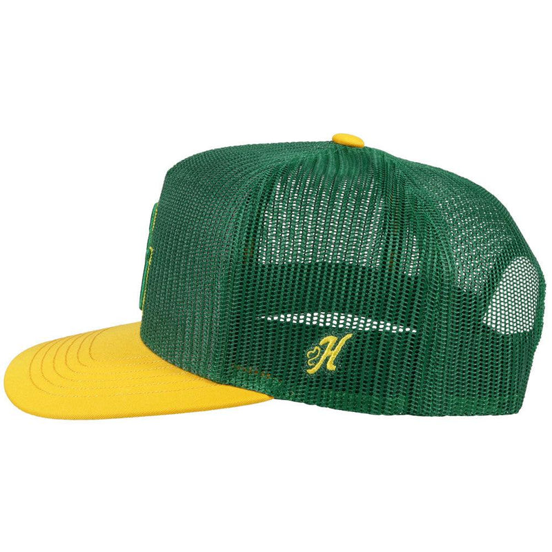 left of the Baylor University green hat with gold bill and green and gold embossed BU patch