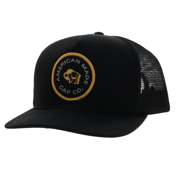 Side angle view of black AMCC hooey hat with gold and grey logo