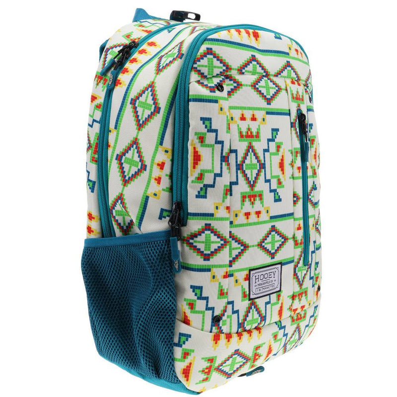 side view of the Rockstar backpack in cream, teal, green, yellow, red breaded pattern and real side pockets