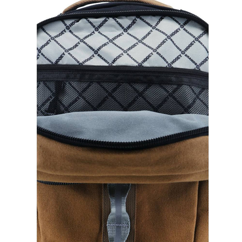 interior of the tan OX backpack with grey base and black Hooey logos in criss cross pattern
