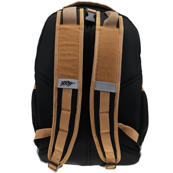 back of the OX tan backpack with black back pad, brown/black/grey straps