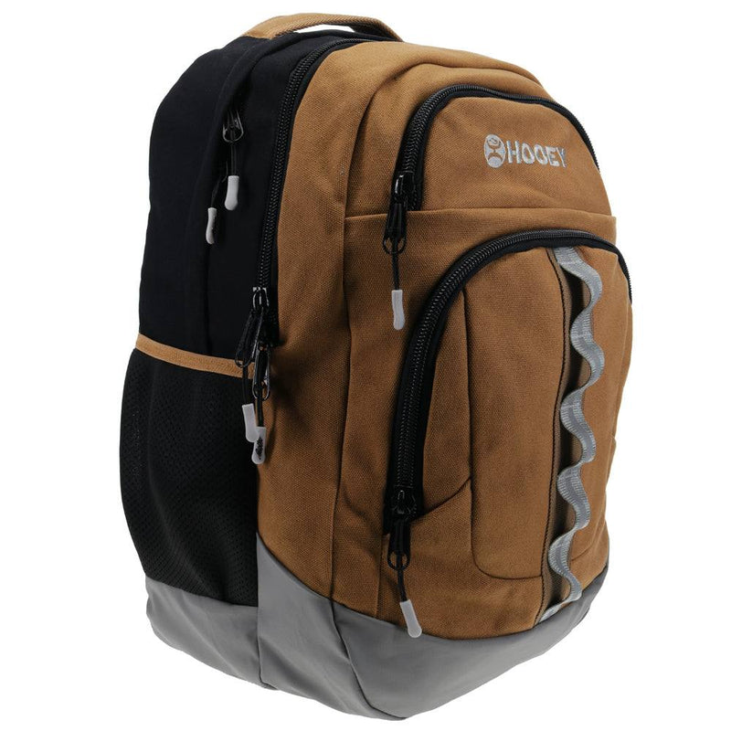 side view of the OX tan backpack with black and grey features