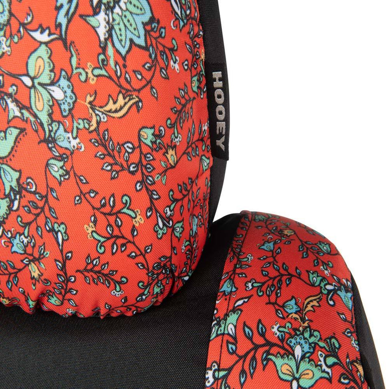 close up of the logo on the headrest portion of western floral red hooey seat cover