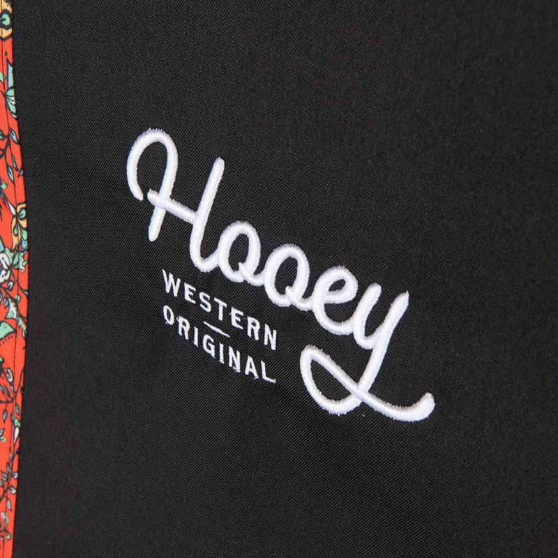 close up of the logo on the western floral red hooey seat cover