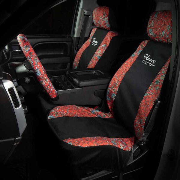 western floral red hooey seat cover and matching steering wheel cover in a car