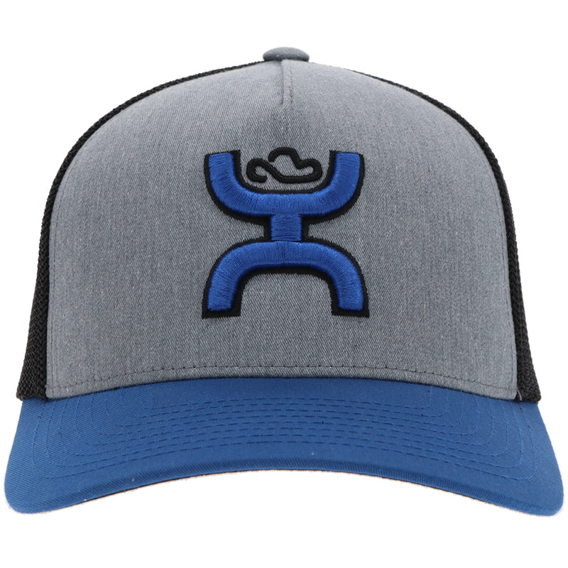 front of the Blue, black, and grey Coach hat