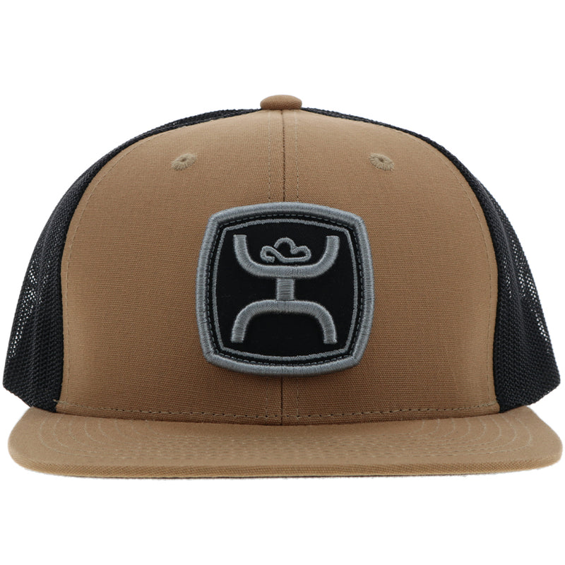 front view of the tan and black hat with black and charcoal patch
