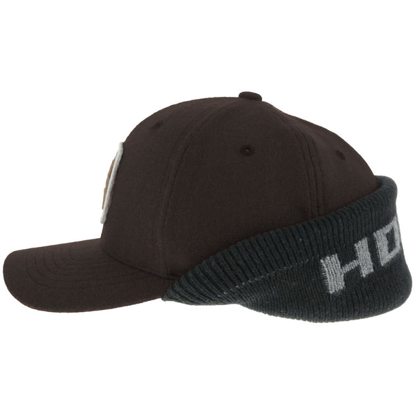 left of the brown Hooey hat with attached ear cover