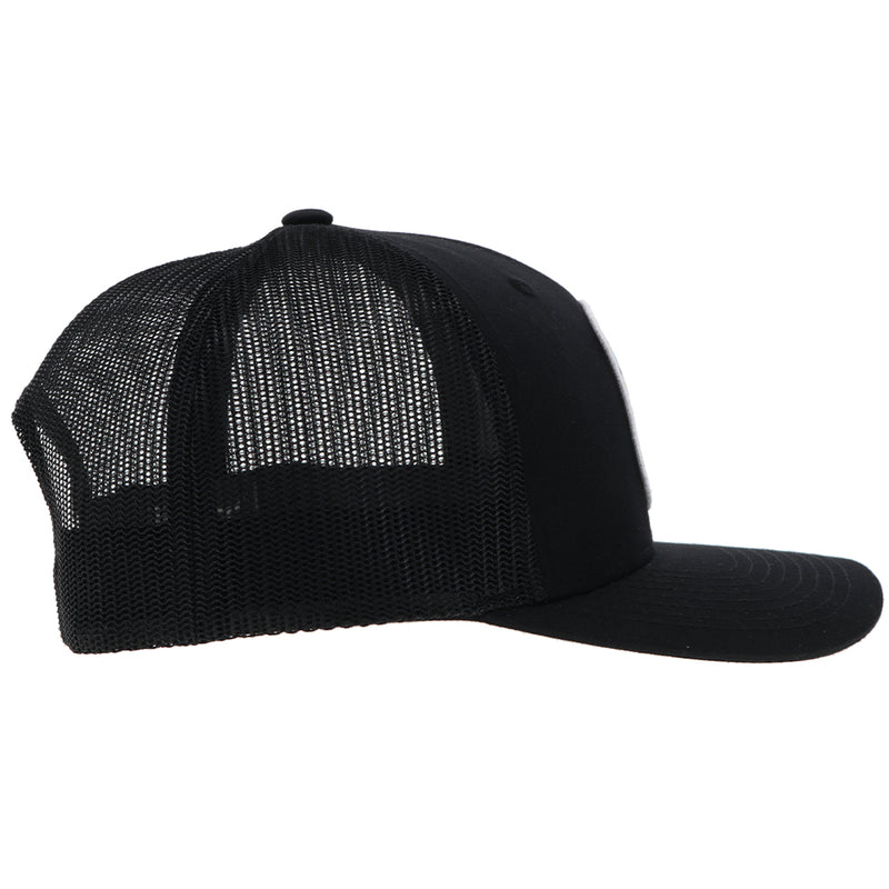 right side of the black on black Cheyenne hat with blue, white, and black patch