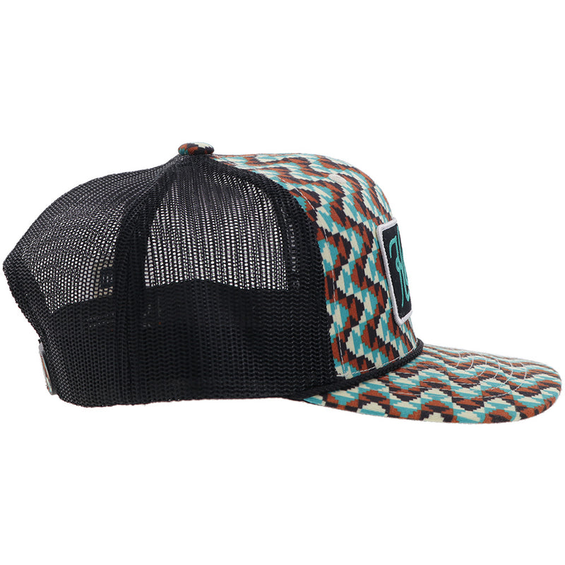 right side of Hooey Western hat with brown, teal, white multi pattern front panel and bill and black mesh with black, white, turquoise patch