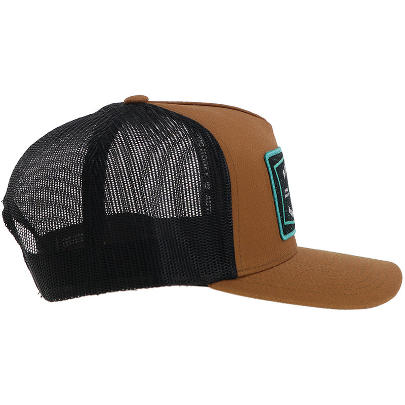 right side brown and black Hooey hat with turquoise, black, white rank stock rodeo company patch