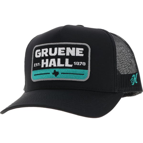front of black on black Gruene Hall hat with teal H logo on side, and white/black/teal logo patch