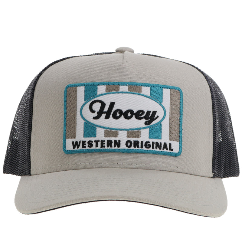 front of black and grey Hooey hat with orange and blue striped logo patch