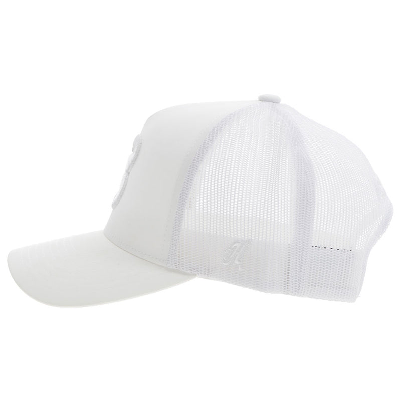 left of the white on white BFO hat with white B patch