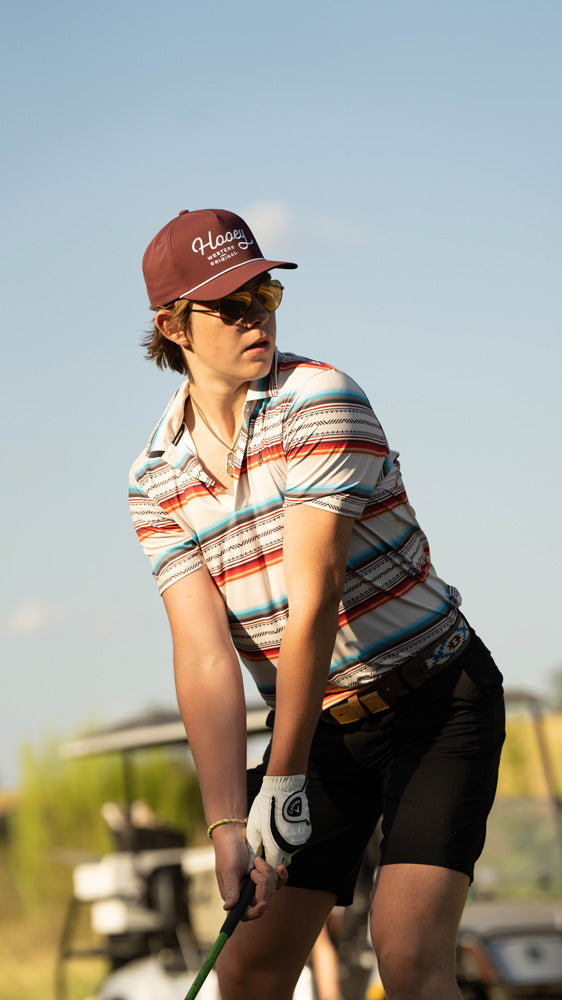 male model posing in hooey golf gear