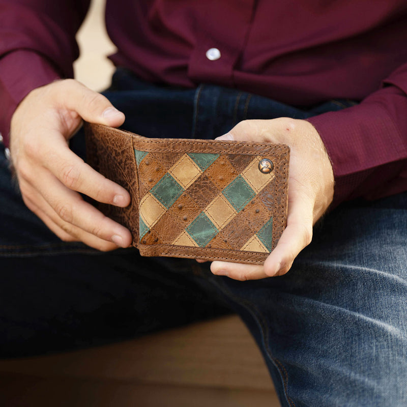 Ouray brown and turquoise ostrich roughy bi-fold wallet held my model wearing hooey clothing