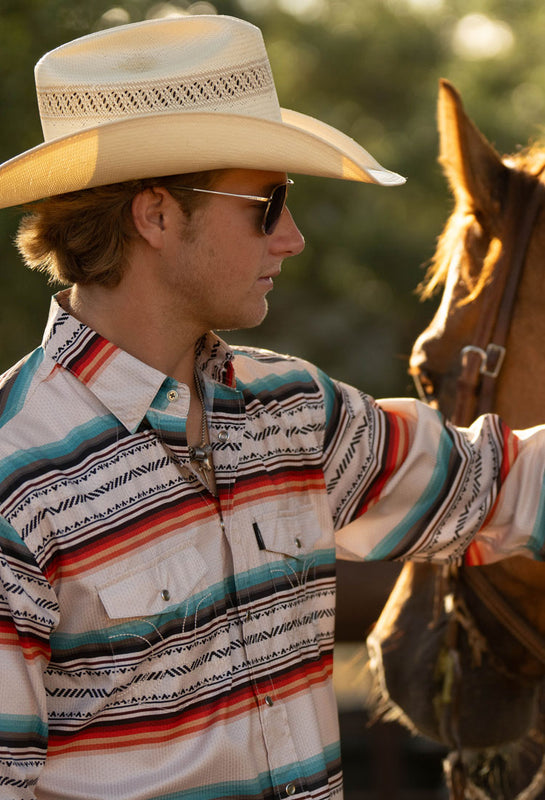 male model posing with his horse while wearing a hooey Sol shirt