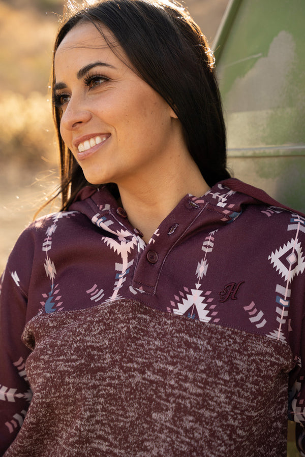 close up image of model wearing the Jimmy charcoal and maroon aztec hoody
