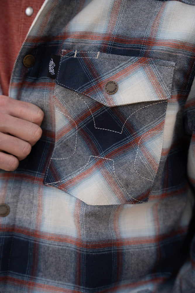 close up of grey and red plaid shacket