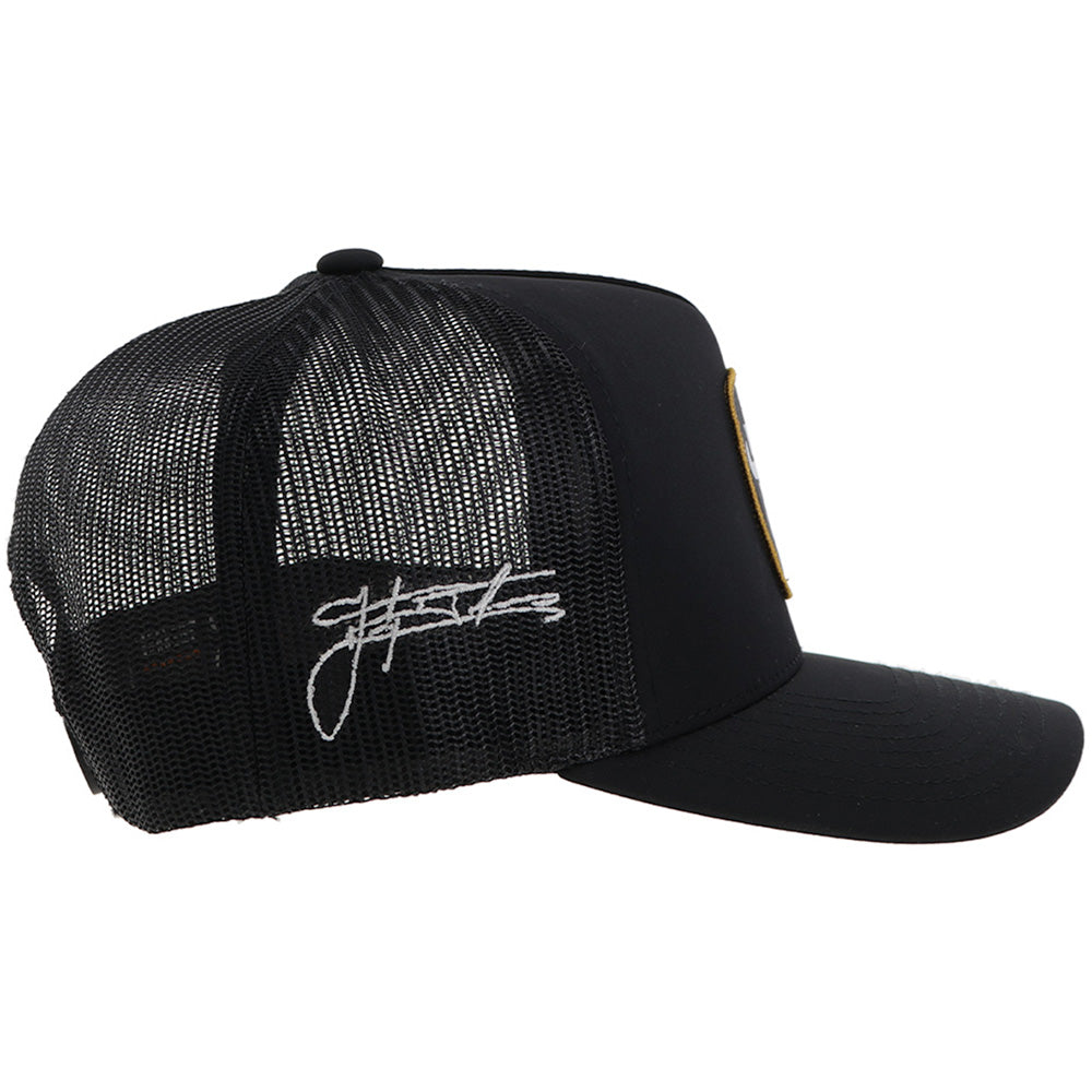 right side of black on black hat with white script logo