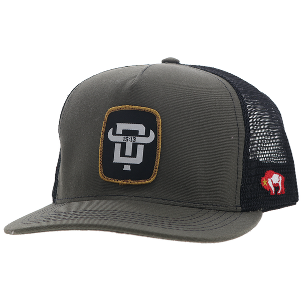 profile of green and black cap with black, white, and gold patch