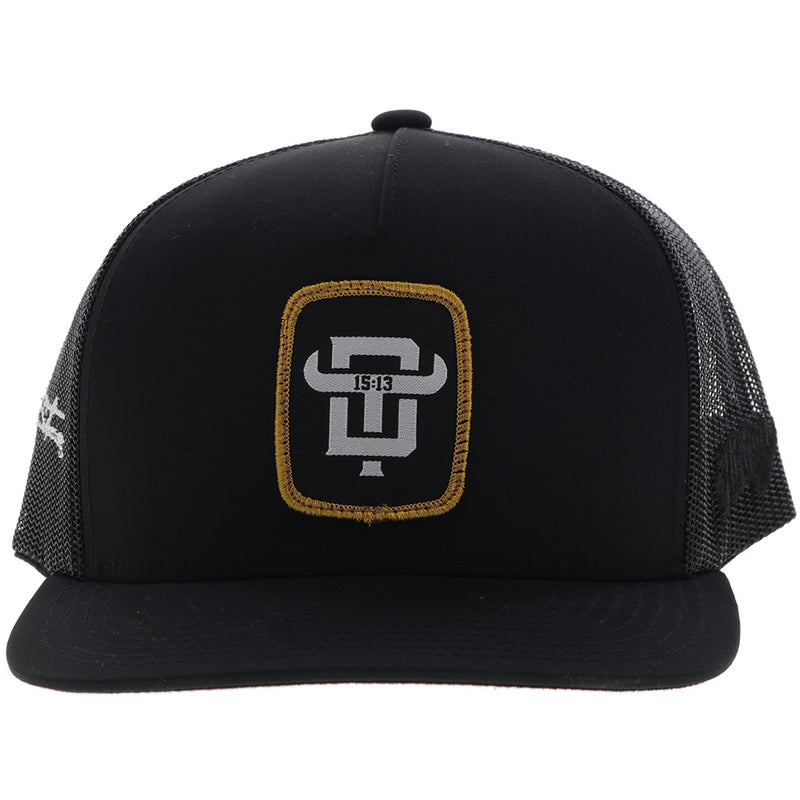 the front of the black with gold and white Dusty Tuckness hat