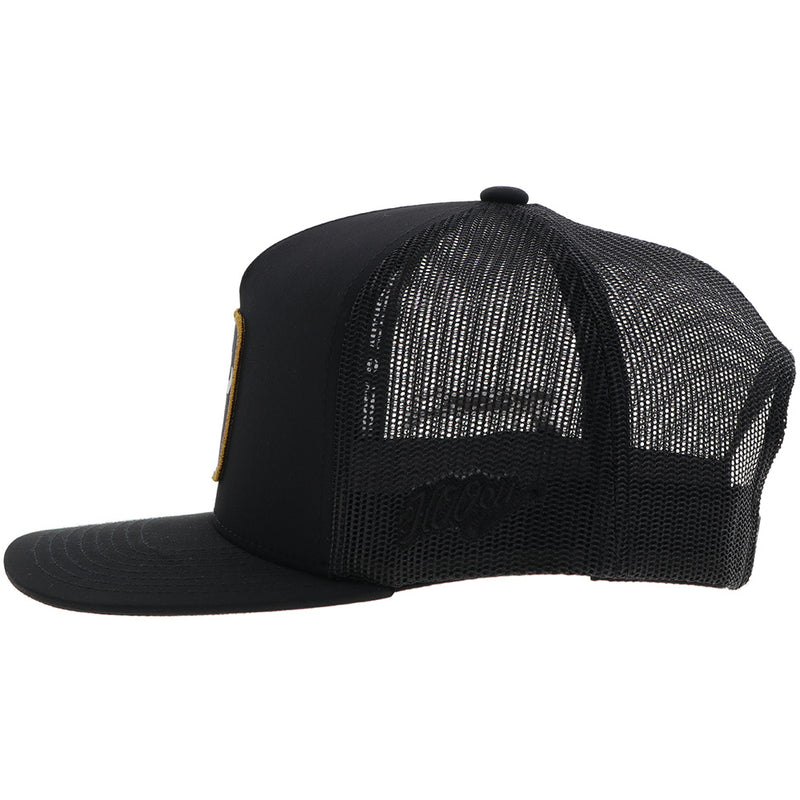 the left side of the black with gold and white Dusty Tuckness hat